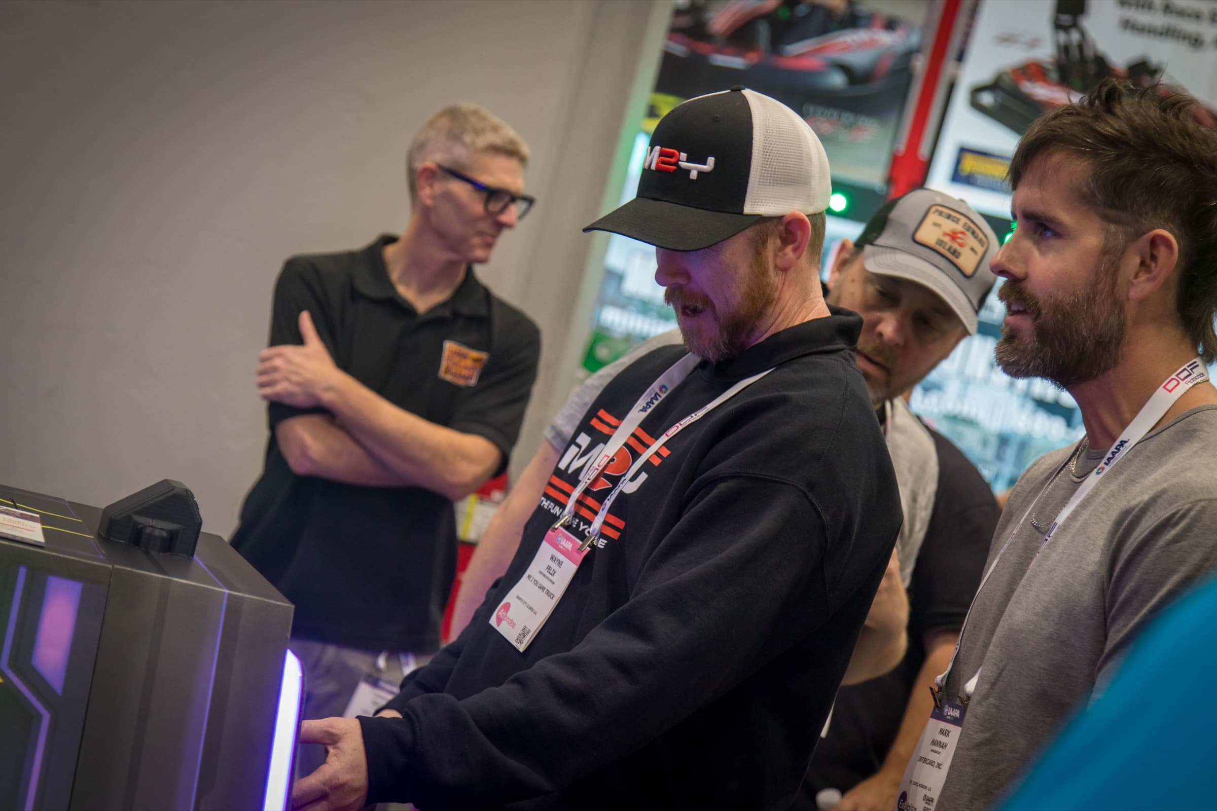 Players focused on a DETONATE challenge while teammates look on